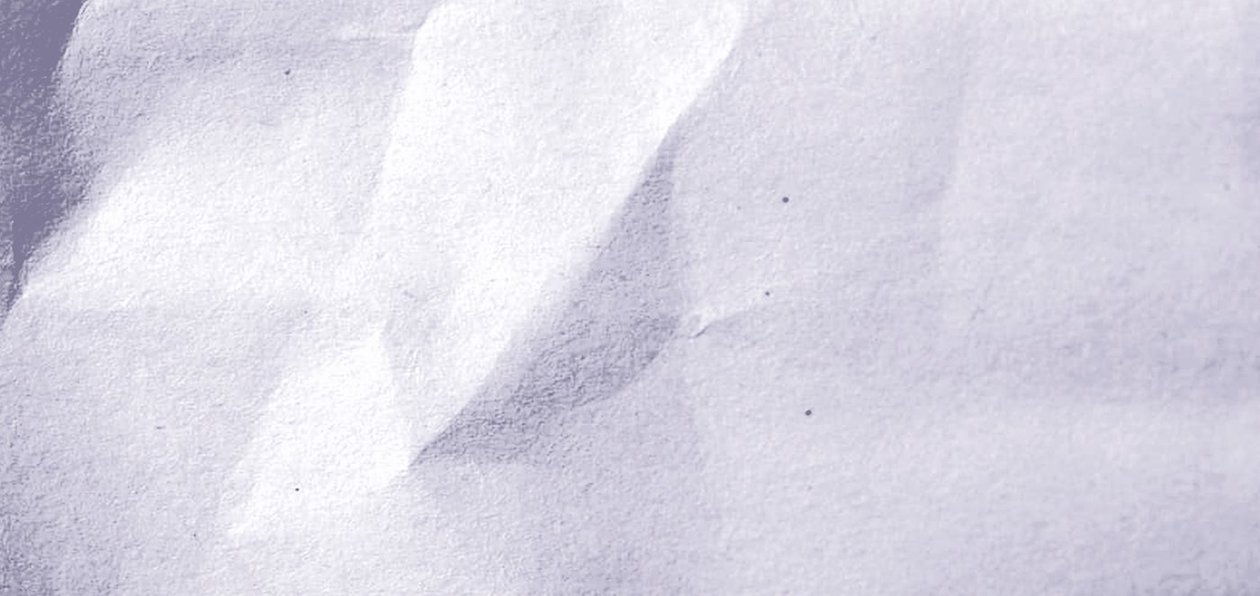 A single fold in a sheet of paper, filling the screen