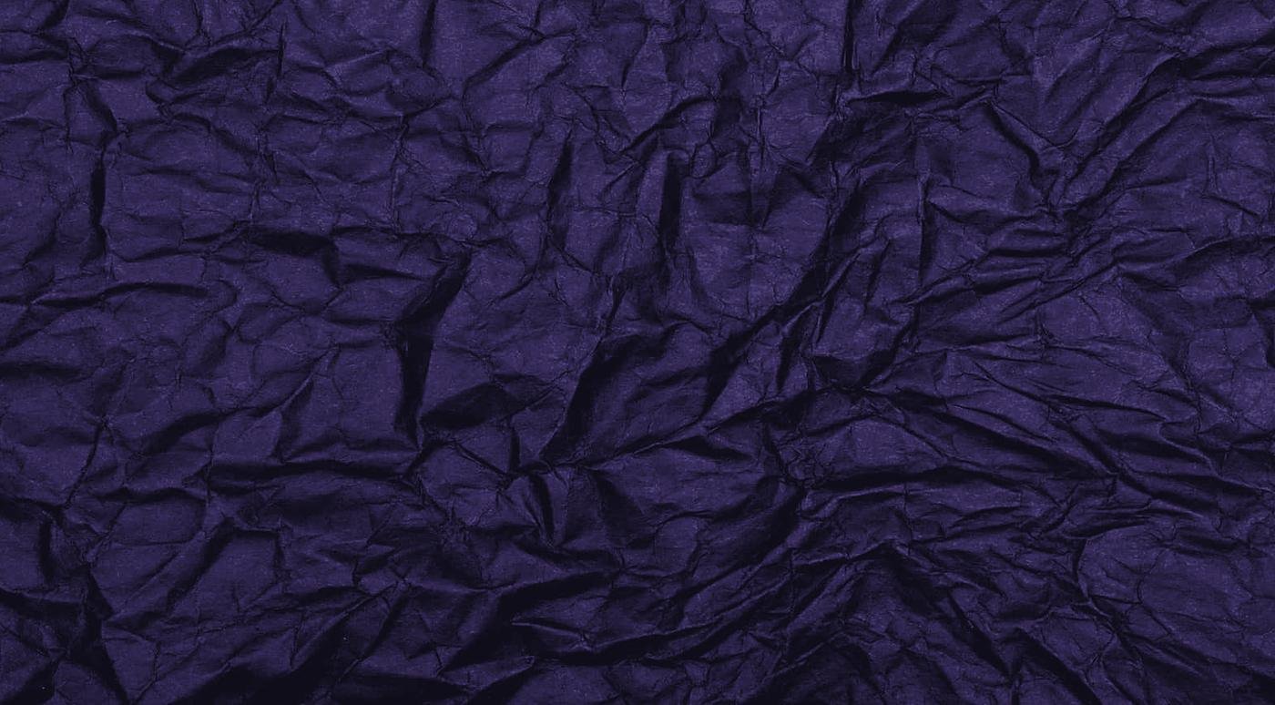 Dark crumpled paper, edge to edge