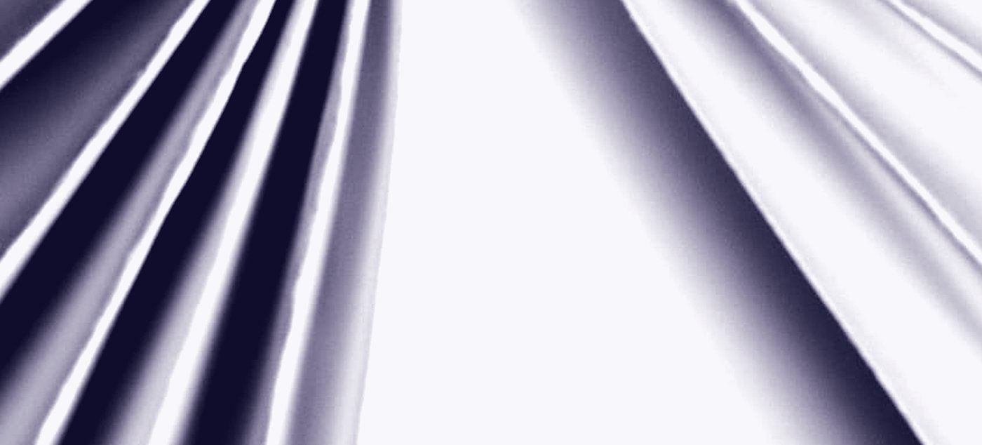 Folded paper, the light raking across the creases