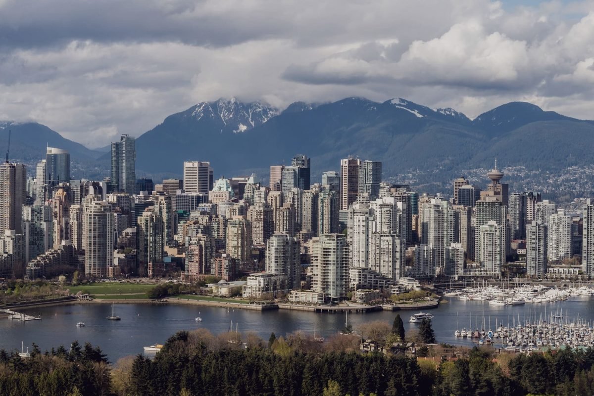 Vancouver seen across the water, mountains behind the towers