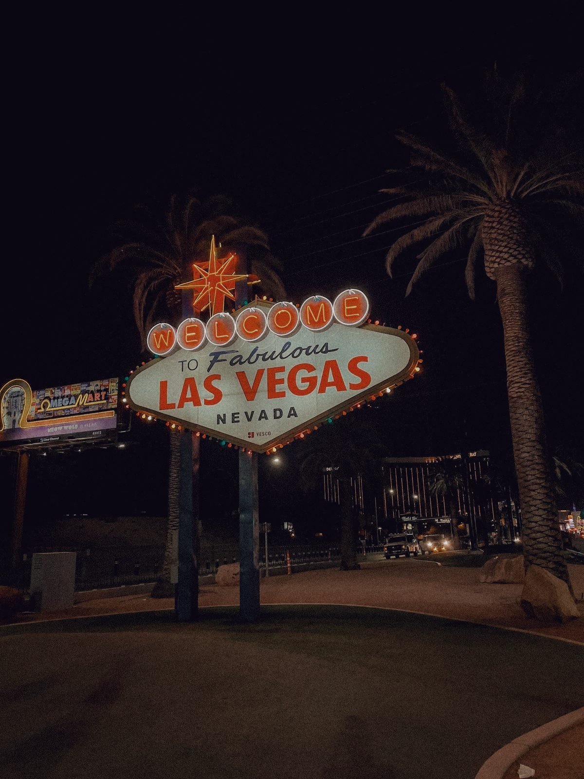 The Welcome to Fabulous Las Vegas sign lit against a night sky.